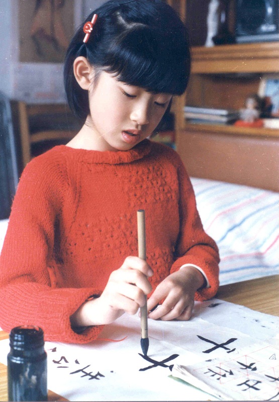 Young Lai Xu practicing Chinese calligraphy in Shanghai.